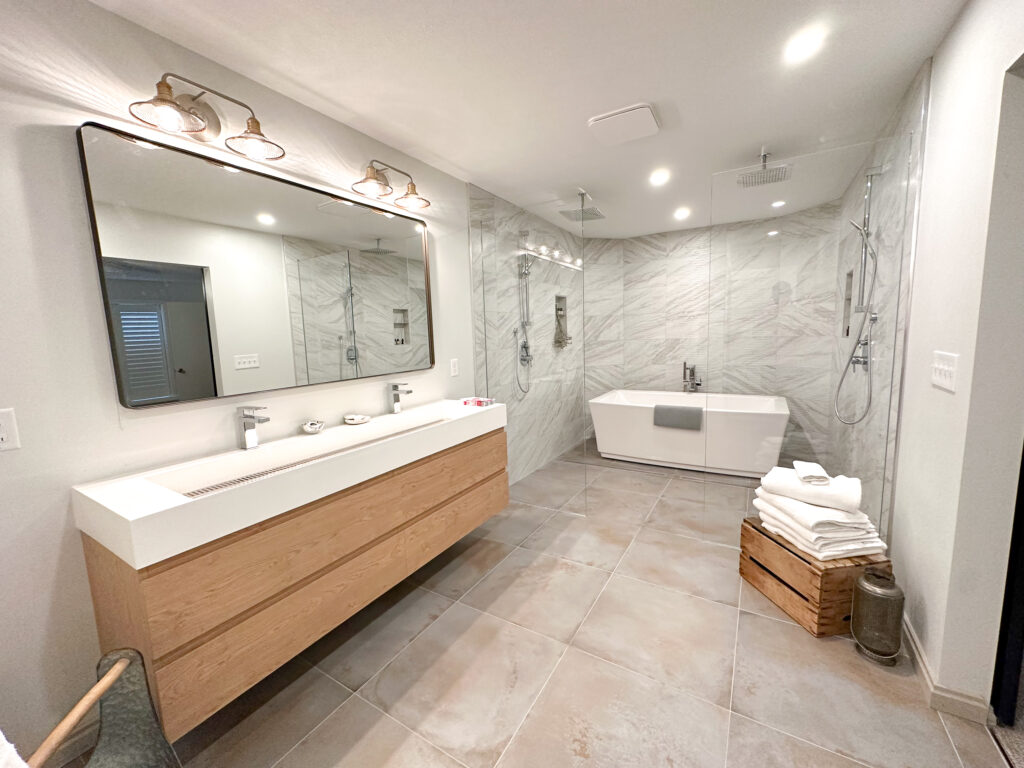 The master suite is sure to wow and provide the ultimate relaxation with a large shower space and gorgeous tub!